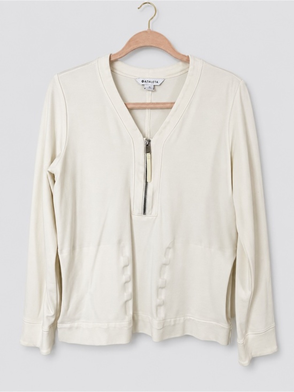 Athleta Eastbound half-zip sweatshirt in a cream color